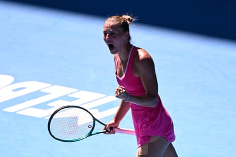 Marta Kostyuk celebrates after winning the second set.