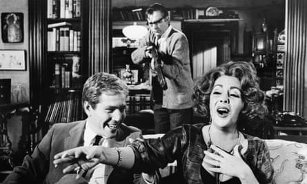 George Segal, Richard Burton (holding the rifle) and Elizabeth Taylor in the film of Who’s Afraid of Virginia Woolf?