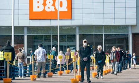 Customers social distancing in the car park of B&Q.