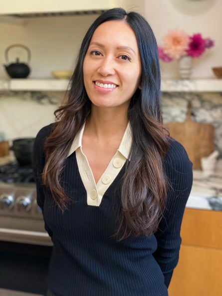 a woman smiles for a photograph