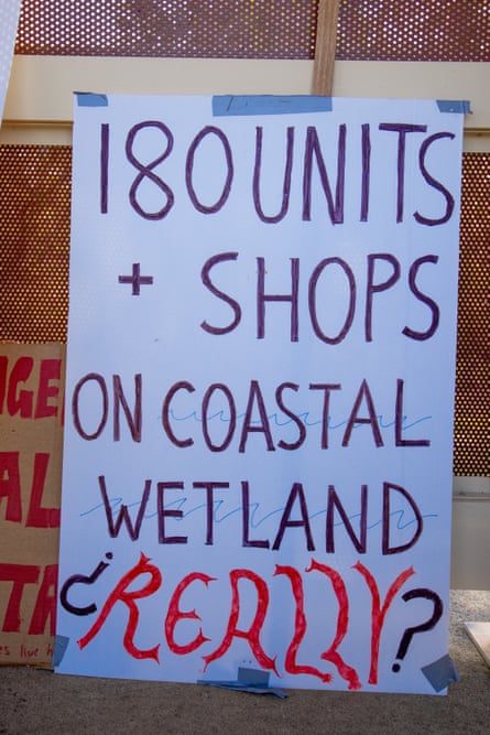 Sign reading 180 units and shops on coastal wetland? Really?