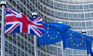 A union jack flutters next to European Union flags in Brussels, Belgium, February, 2016