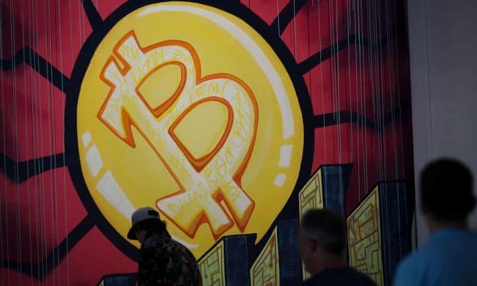 A banner with the logo of bitcoin is seen during the crypto-currency conference Bitcoin 2021 Convention in Miami, Florida.