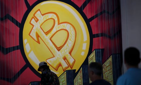A banner with the logo of bitcoin is seen during the crypto-currency conference Bitcoin 2021 Convention in Miami, Florida.