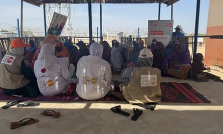 Fears of Boko Haram comeback stir in Nigerian birthplace of Maiduguri People sit on mats under the shade of an outdoor structure