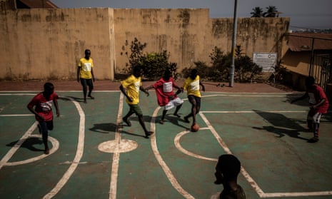 Patients play football, which was introduced as part of an effort to add therapeutic options, at the Sierra Leone Psychiatric Hospital in Freetown, Sierra Leone.