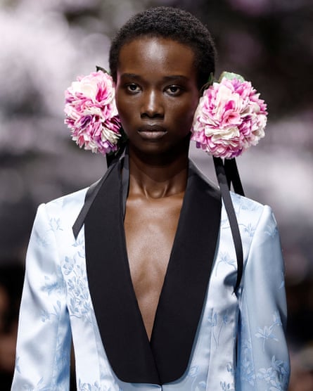 A model wearing large pink earmuffs
