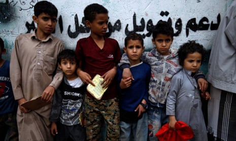Yemeni children wait to get food rations from a charity group in Sana’a, Yemen, on 4 May 2020. According to reports, nearly 80 percent of Yemen’s 27 million-population rely on humanitarian aid.