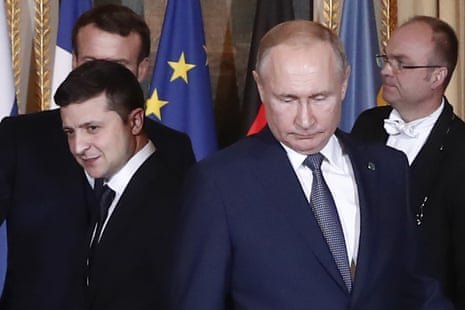 Volodymyr Zelenskyy and Vladimir Putin at the Élysée Palace in 2019. The pair did not shake hands or acknowledge each other at a press conference after the meeting.