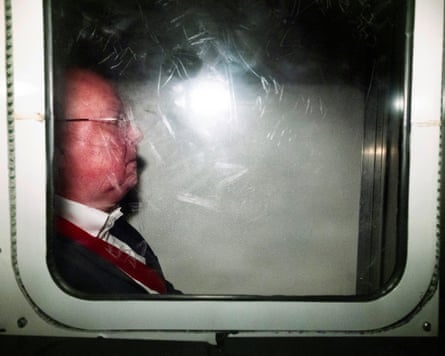 Peter Murrell behind the window of a van