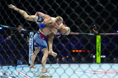Bo Nickal grapples Kyle Daukaus during their middleweight fight.