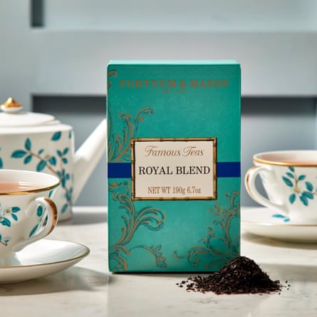 A box of Fortnum and Mason’s Royal Blend tea set amongst a decorative tea set
