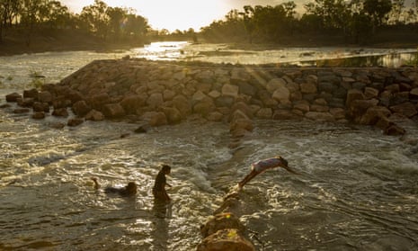 Kids are seen swimming at Brewarrina Weir in northern NSW on February 16, 2020 in Brewarrina, Australia as rain water from upstream flowed into the once dry river beds. 