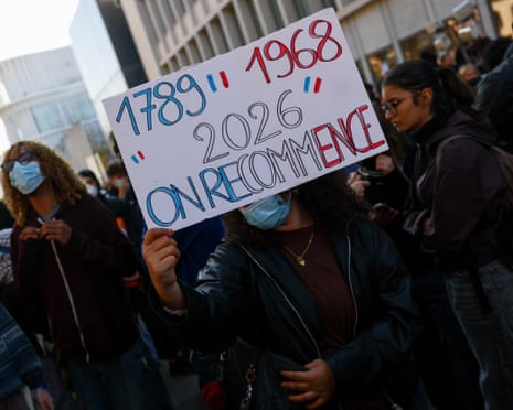 A protester holds a placard on the day French high school and university students attend a demonstration in Strasbourg.