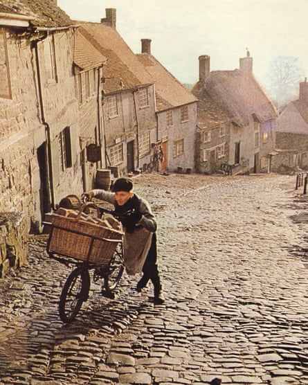 A boy pushing a bike up a cobbled road in Ridley Scott’s ad film for Hovis.