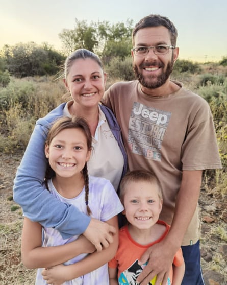Family of four smiling
