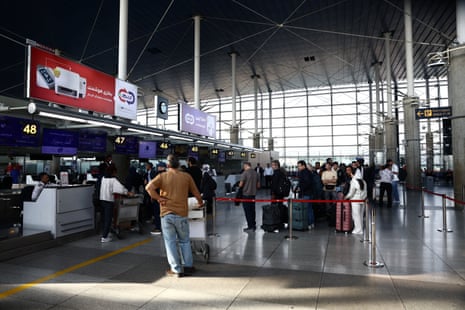 Passengers stand in a line at the terminal hall in Imam Khomeini Airport, in Tehran, Iran.