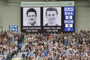 The players and crowd give a minutes applause in honour of late footballers John Shepherd and Jimmy Collins who both died earlier in the year.
