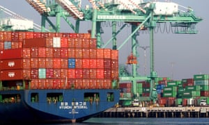 A container ship enters the Port of Los Angeles on 30 November in San Pedro, California, as analysts fear the OmicronCovid variant will increase pressure on supply chains and worsen existing shortages of labour and materials.