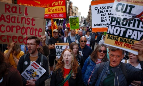 Supporters of the RMT industrial action protest outside Network Rail’s office in Glasgow.