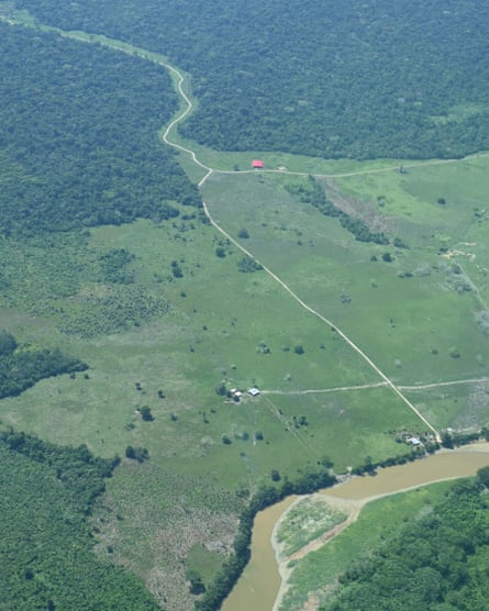 An overhead view of a route through the Amazon forest and across fields to a river