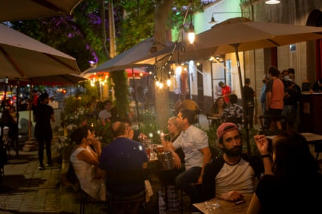 People sit in bar terraces in downtown Santiago, on 23 December, 2020