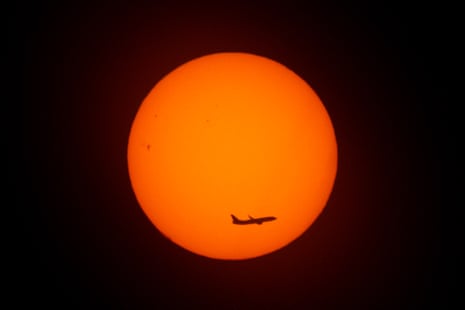 An aircraft flies at sunrise on Thursday morning in Buenos Aires.