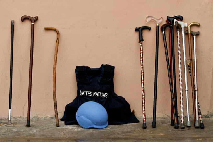 The walking sticks commonly carried by Somali elders and the protective gear worn by the United Nations staff