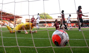 Bournemouth’s goalkeeper Aaron Ramsdale looks disappointed as Crystal Palace’s Jordan Ayew (second right) wheels away in celebration after opening the scoring at the Vitality Stadium.