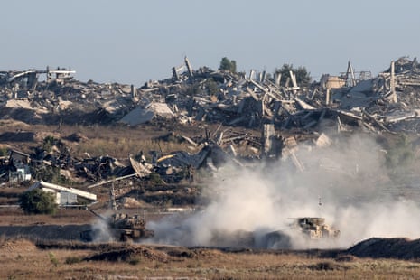 Israeli army vehicles deploy in the Gaza Strip near the border with southern Israel.