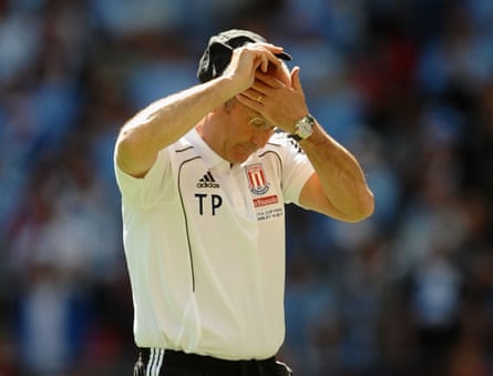 Tony Pulis of Stoke City reacts in defeat.