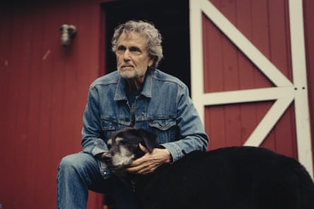 Chris Sarandon with his dog, both looking ruminatively into the distance.