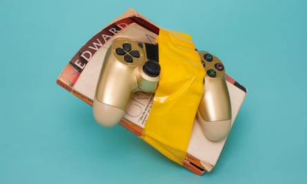 A games controller taped to a book