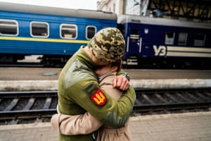 A soldier hugs his partner in Lviv, western Ukraine.