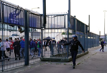 A scene at the Stade de France as police use teargas on Liverpool fans.
