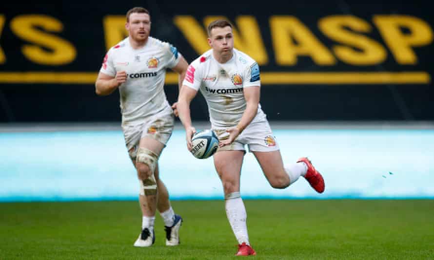 The Exeter captain, Joe Simmonds (right), passes the ball with his brother Sam Simmonds watching on.