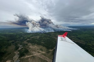 Aerial view of smoke rising from a large area of rural land