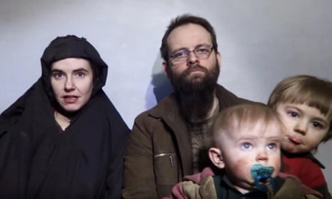 A still image from a video shows American Caitlan Coleman speaking next to her Canadian husband Joshua Boyle and their two sons.