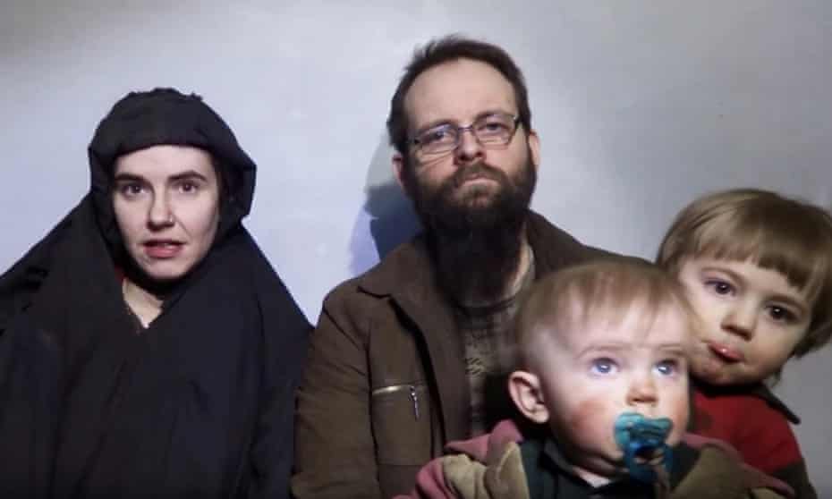 A still image from a video posted by the Taliban on social media on 19 December 2016 shows American Caitlan Coleman, left, speaking next to her husband Joshua Boyle and their two sons.