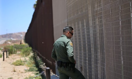 A US border agent patrols the wall in San Ysidro, California.