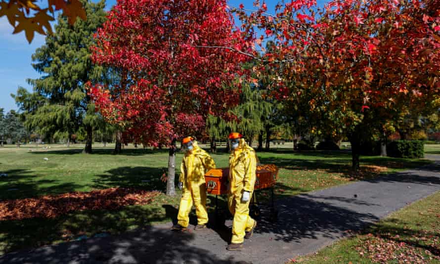 Gravediggers in Buenos Aires wear protective equipment during an exercise for Covid burials.