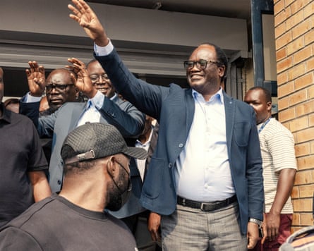 Brian Mundubile waves to supporters as he leaves a radio station in Lusaka.