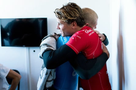 Mick Fanning (hugs) hugging fellow Julian Wilson after the shark attack.