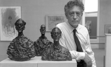 Giacometti with three of his sculptures at the Venice Biennale in 1962 
