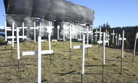 The 73 crosses signifying Covid-19 deaths in Nevada county, sit on the hill next to Old Barn Storage in Grass Valley, California, last month.