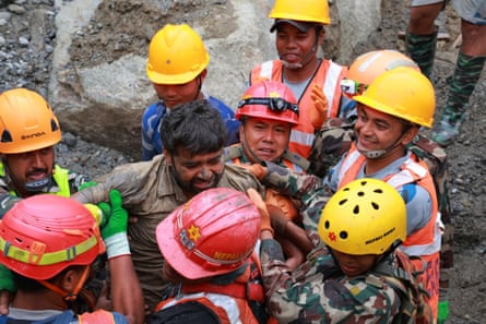 Sanjay Shah seen on the back of a rescue worker was the first person rescued from the Hydro Power Tunnel in Nepal.