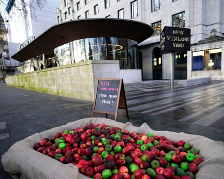 Rotten apples in a basket and a sign reading ‘1071 bad apples, how many more?’