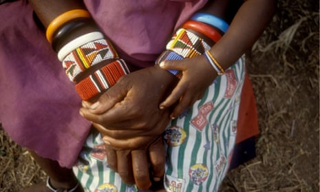 A Maasai woman and her baby wearing bead bracelets.