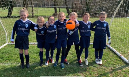 Reporter Lisa Bachelor’s eight-year-old daughter Orla, centre, with her teammates from Meninas FC.