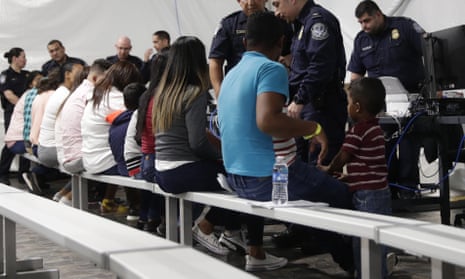 Migrants applying for asylum in the United States go through a processing area at a new tent courtroom in Laredo, Texas. 